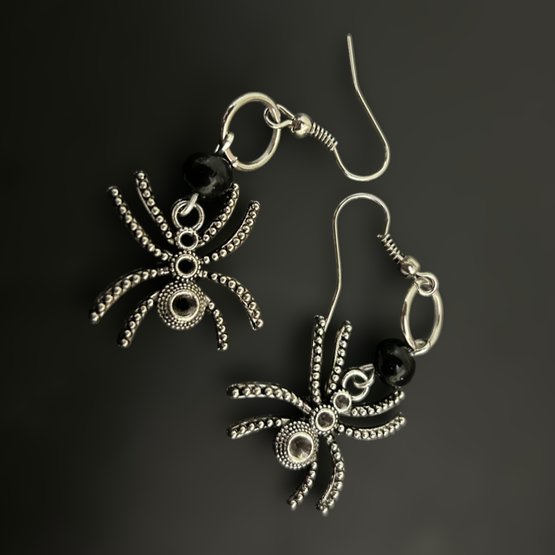 German silver oxidized spider earrings for a gothic cult look. Round black beads and intricate spider charms - perfect for whimsical fashion and cosplay looks.