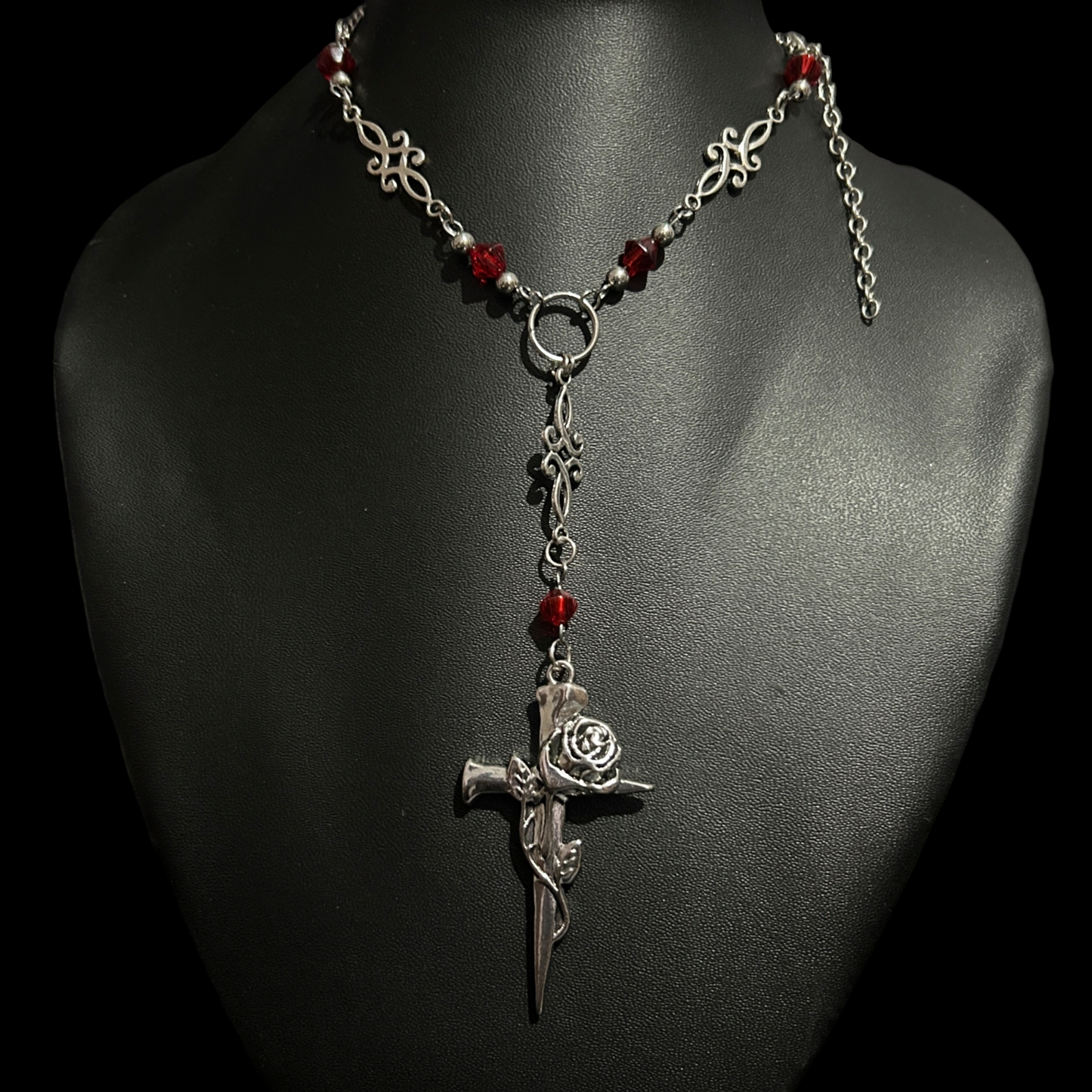 Front view of Phantom Cat India's Blood and Roses Cross Necklace -Y-drop cross pendant with a rose detail. Gothic fashion jewelry ideal for grunge, alt-core, and dark romantic styling.