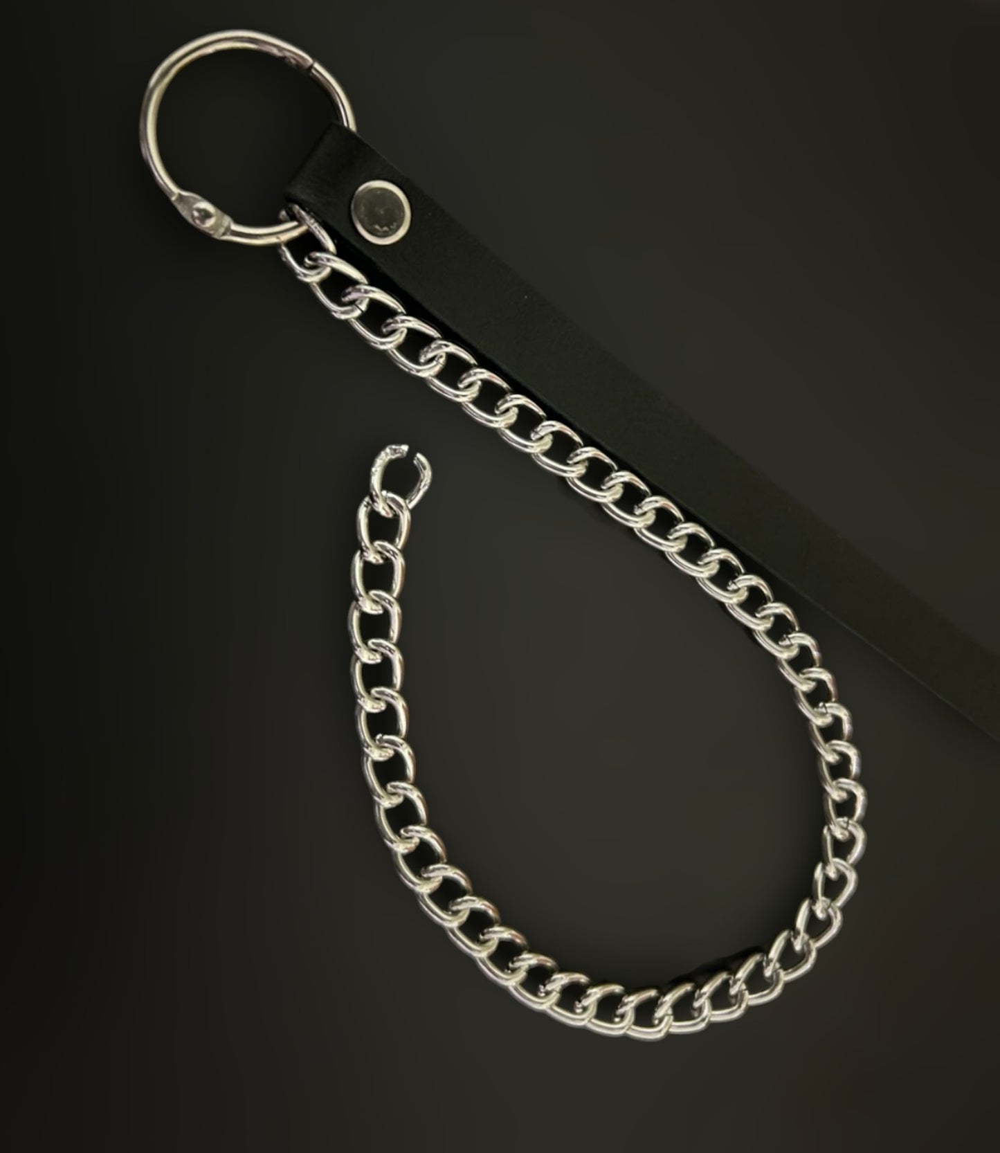 Flat lay of thick soft grain leather wrist cuff with anti tarnish chains — industrial alt bracelet from Phantom Cat. Gothic grunge accessories India, unisex jewelry for punk, y2k, and alt-core fashion. Lightweight, comfortable, and built to last.