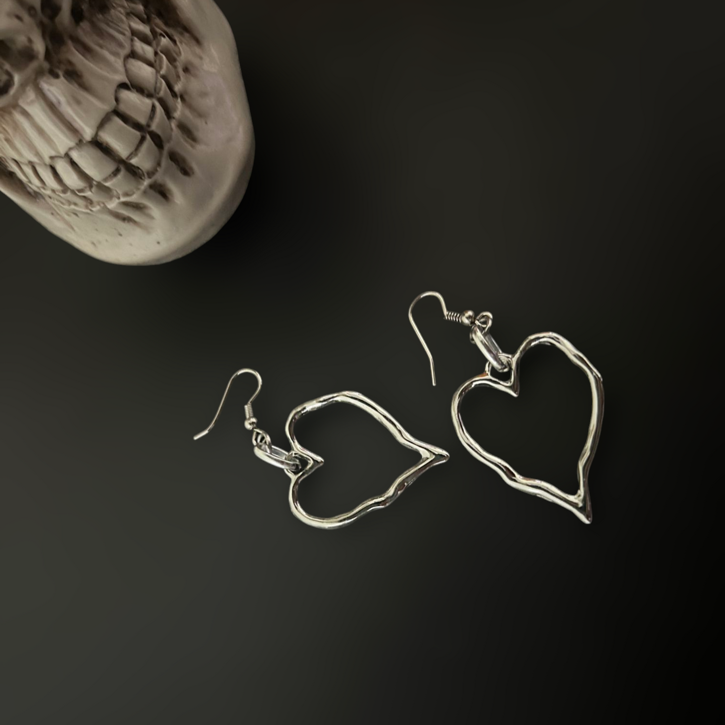 Twisted Heart Shaped Gothic Earrings for lovers of punk and y2k fashion in India. Goth romance fusion with industrial accessories for cosplay and styling. Gothic skull setting.