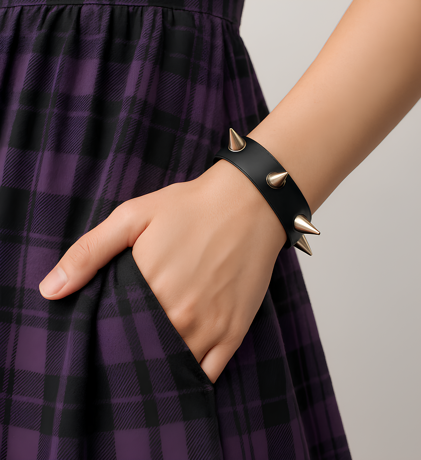 On-model wrist close-up of Phantom Cat spike leather cuff — black natural organic leather bracelet with cone spikes studs. Shop unisex gothic and grunge accessories and jewelry online in India.