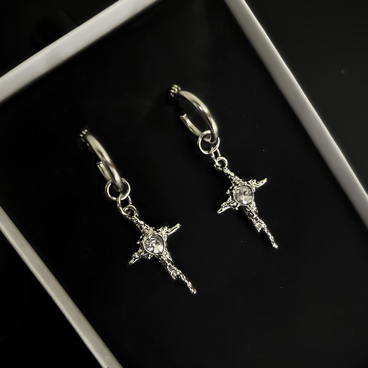 Silver gothic cross hoop earrings by Phantom Cat India - grunge jewelry for alt, gothic, and rockstar fashion. Edgy accessories for y2k, k-pop, and anime cosplay street style lovers.