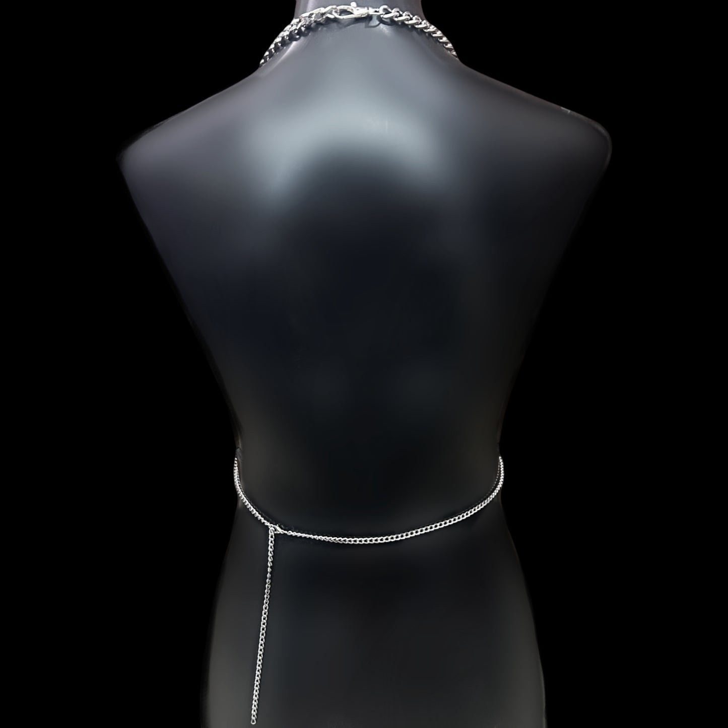Back view of Obsidian Veil body harness by Phantom Cat. Minimal gothic chain detail at waist for grunge and alt style.