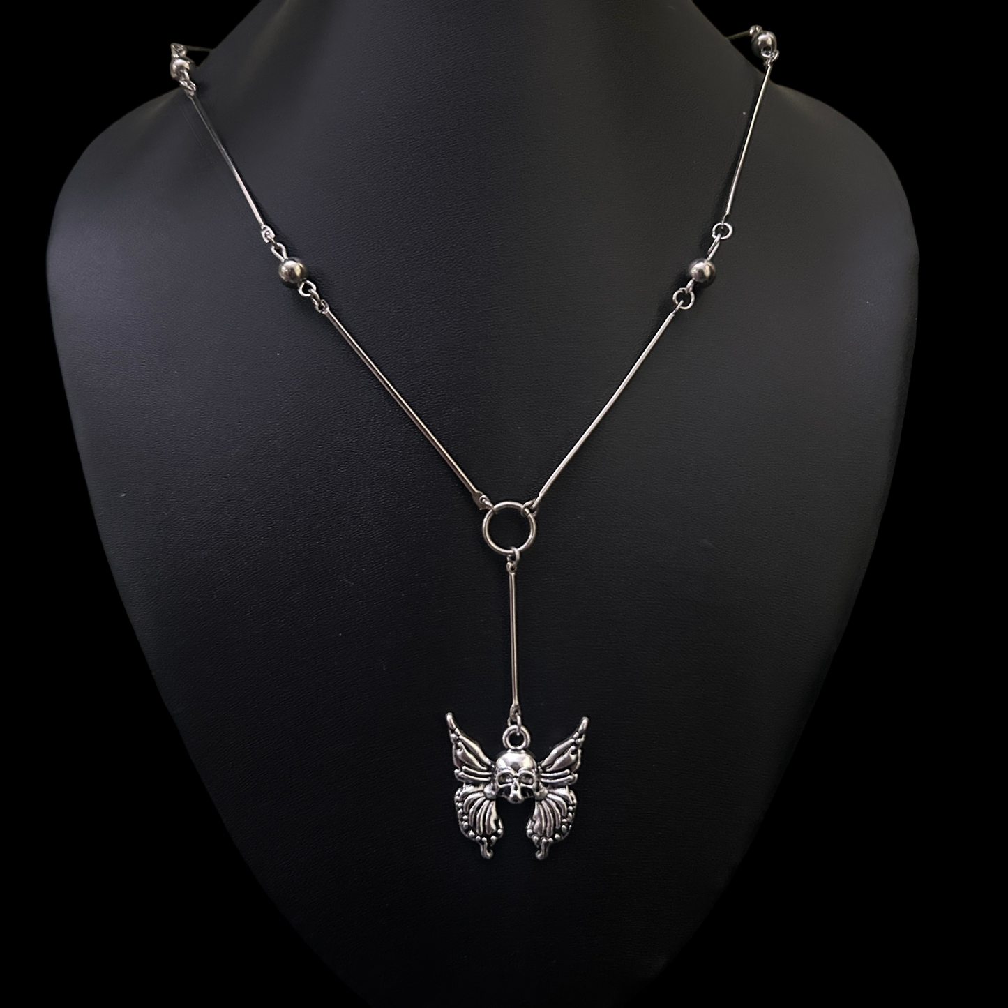Front view of Skull Wing Bones Gothic Necklace by Phantom Cat India. Y drop spine chain with a skeletal butterfly motif, ideal for alternative, cosplay, and streetwear styling in India