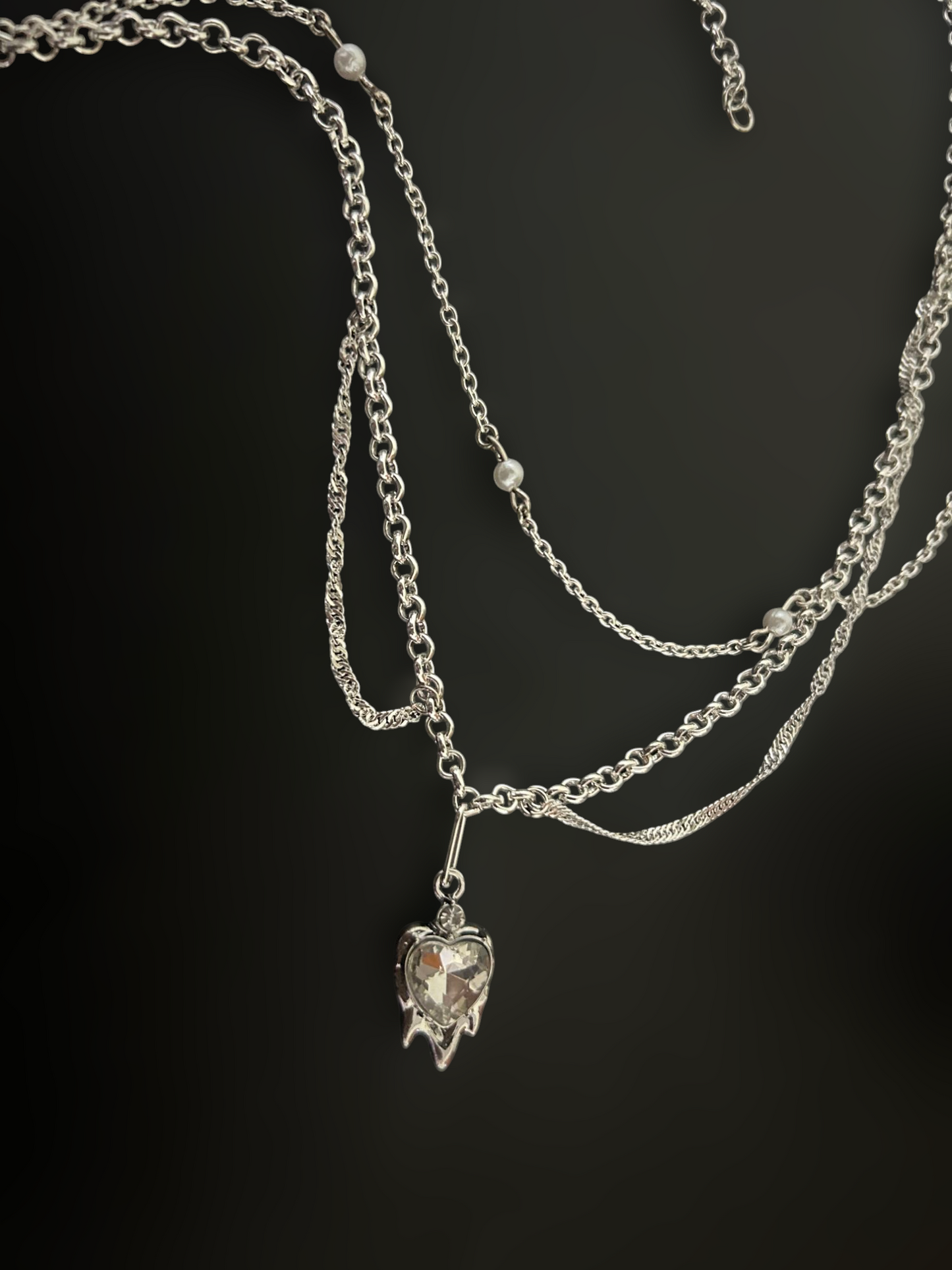 Witchlock Goth Punk Necklace by Phantom Cat. Layered Y2K silver chains with pearl beads and dripping heart crystal pendant. Grunge and concert jewelry for everyday wear.