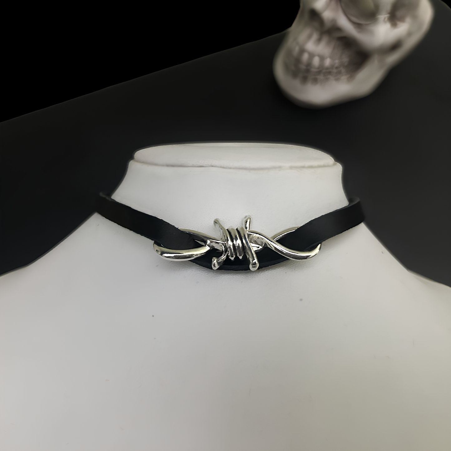 Unisex gothic leather collar by Phantom Cat feat. barbed wire motif. Shop grungecore, y2k and rockstar accessories online in India. Perfect for lovers of cosplay and goth styling. 