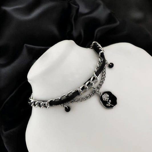 Black leather choker with stainless steel curb chain, black beads, and a wax seal rose charm sigil. Shop handmade gothic and grunge jewelry and accessories online in India. 