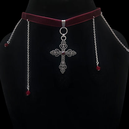 Gothic velvet choker with intricate silver cross pendant and red beaded chain drops on black mannequin – gothic, grunge, alt fashion jewelry