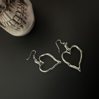 Twisted Heart Shaped Gothic Earrings for lovers of punk and y2k fashion in India. Goth romance fusion with industrial accessories for cosplay and styling. Gothic skull setting. 