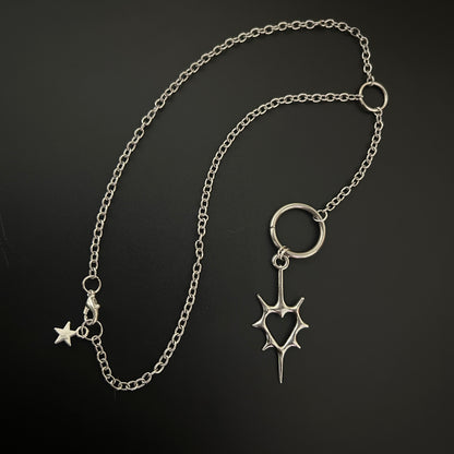 Close-up of gothic necklace with a spike heart pendant. Shop grunge fashion accessories in India - perfect for alt, street style and cosplay. 