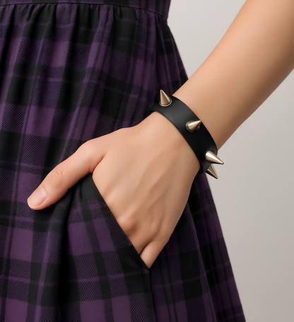 On-model wrist close-up of Phantom Cat spike leather cuff — black natural organic leather bracelet with cone spikes studs. Shop unisex gothic and grunge accessories and jewelry online in India. 