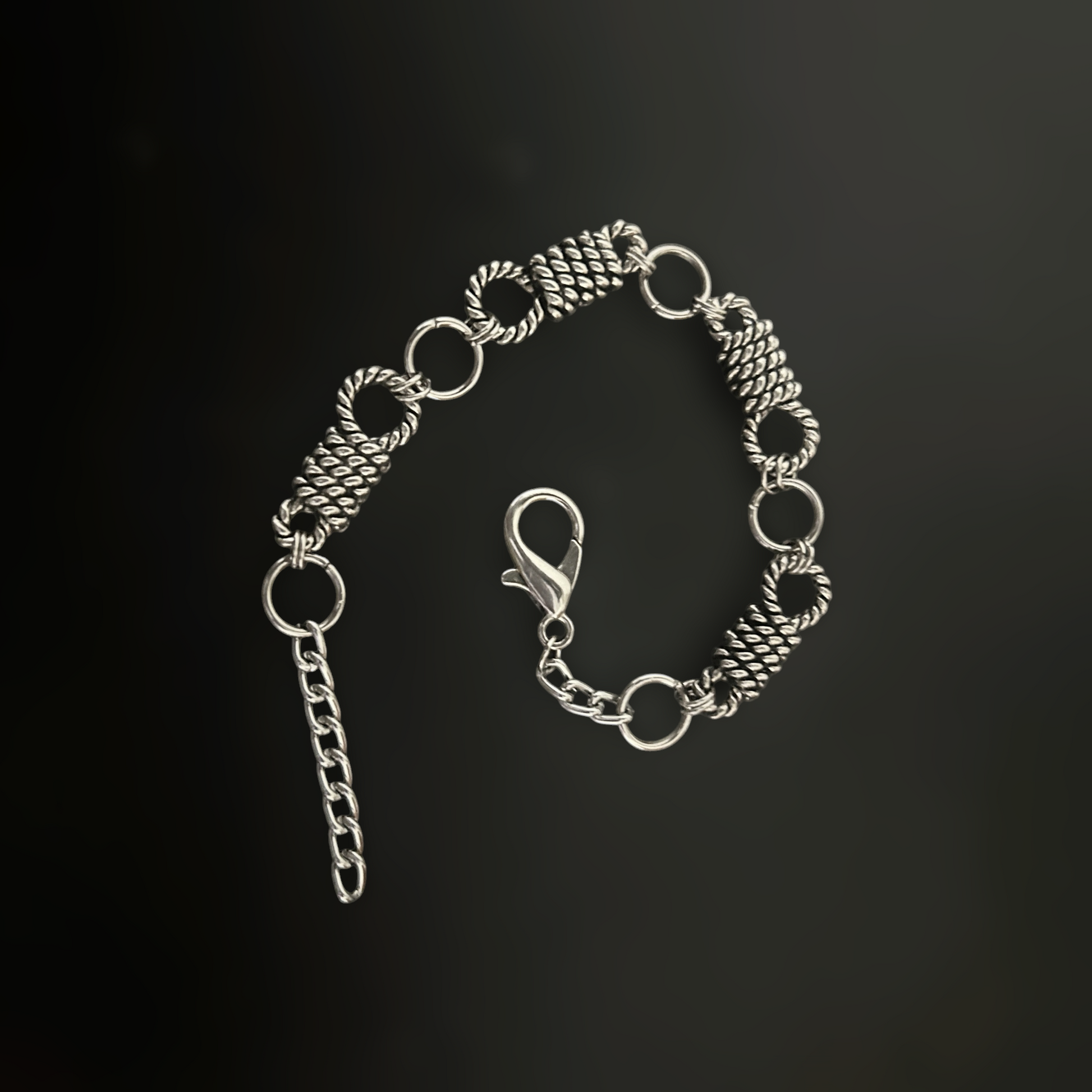 Silver gothic bracelet with twisted rope links, alt jewelry for rockstar, y2k, k-pop, and anime cosplay street style for gothic and grunge fashion lovers across India 