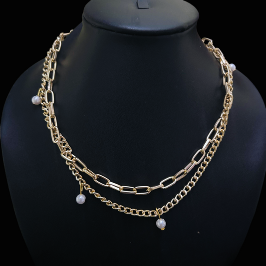 Hypoallergenic gold necklace with layered chains and mystical pearl drops, showcasing gothic-alt fantasy style on a black mannequin.