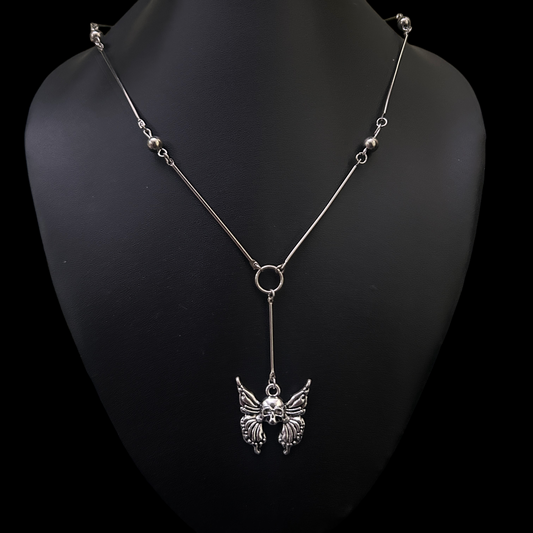 Front view of Skull Wing Bones Gothic Necklace by Phantom Cat India. Y drop spine chain with a skeletal butterfly motif, ideal for alternative, cosplay, and streetwear styling in India