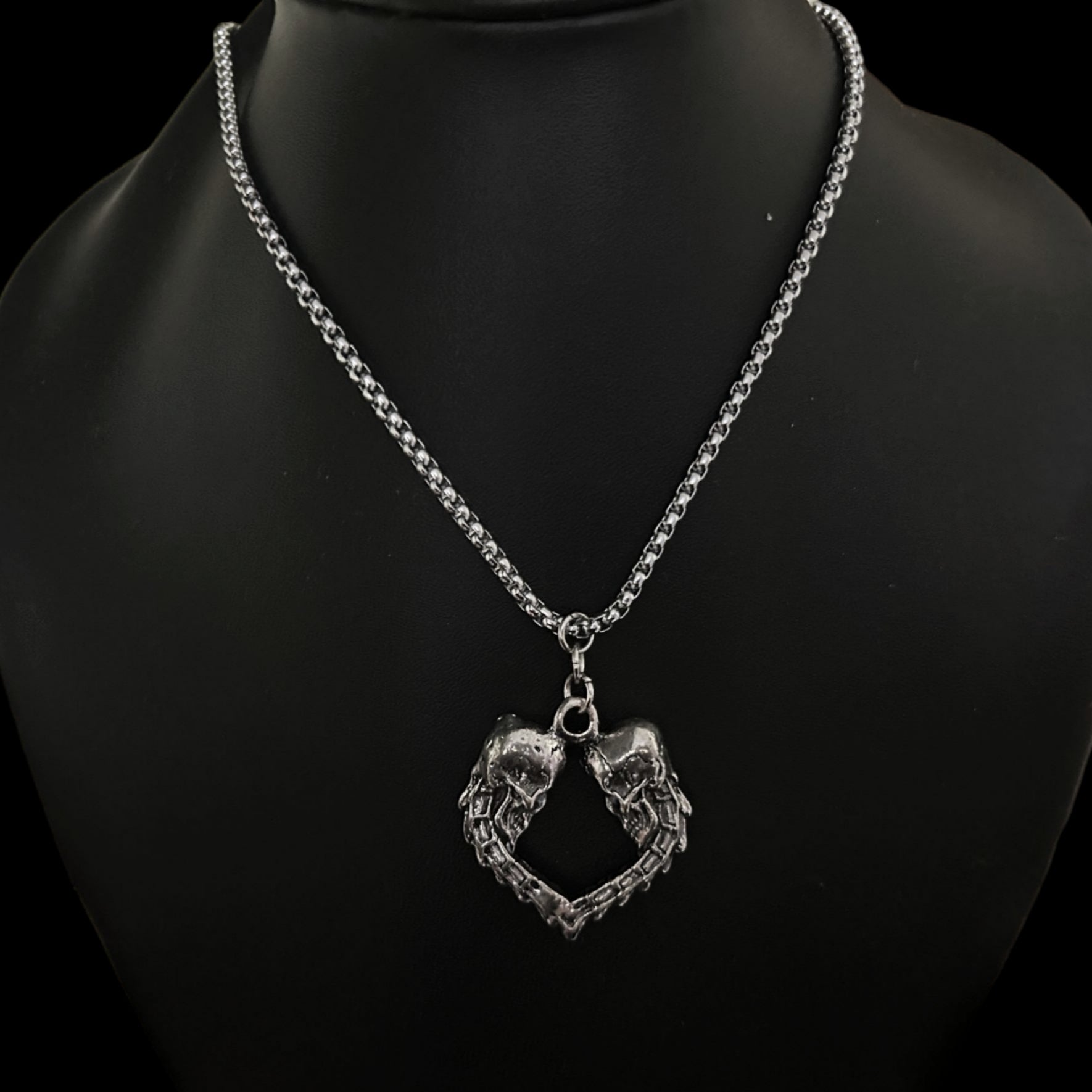 Front view of Spinal Love necklace by Phantom Cat. Shop kpop cosplay fashion accessories for men and women in India. Detailed Skull Heart Gothic Pendant with curb chain. 