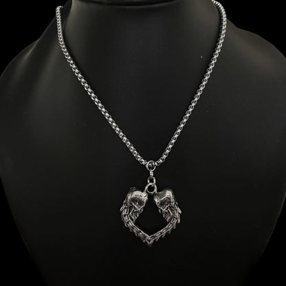 Front view of Spinal Love necklace by Phantom Cat. Shop kpop cosplay fashion accessories for men and women in India. Detailed Skull Heart Gothic Pendant with curb chain. 