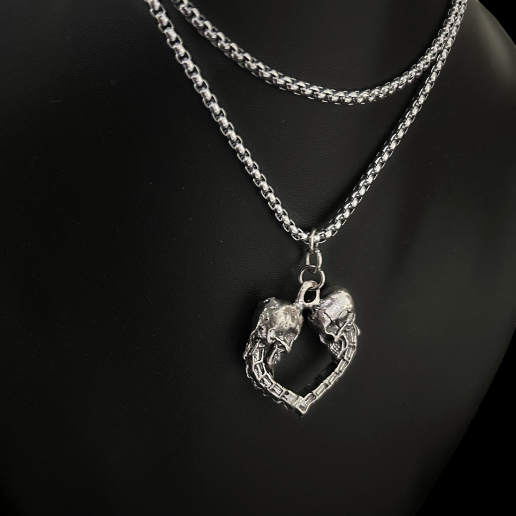 Side view of Spinal Love Pendant layered look - Gothic skull unisex accessories, jewelry, necklaces and keychains for lovers of punk, alt and grunge wardrobes. Pair with mesh, boots,  and leather collars.  