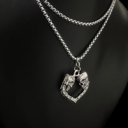 Side view of Spinal Love Pendant layered look - Gothic skull unisex accessories, jewelry, necklaces and keychains for lovers of punk, alt and grunge wardrobes. Pair with mesh, boots,  and leather collars.  