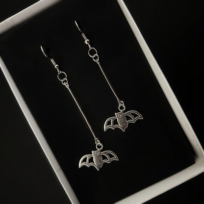 Top view of lightweight batman silver earrings — gothic and concert fashion accessories India, Phantom Cat alt jewelry for daily wear.