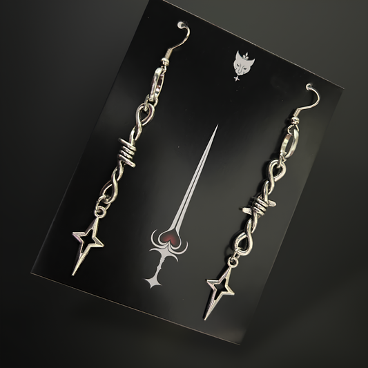 Gothic barbed wire nova star motifs earrings by Phantom Cat India. Grunge and alt accessories for women - perfect for y2k styling and anime cosplay