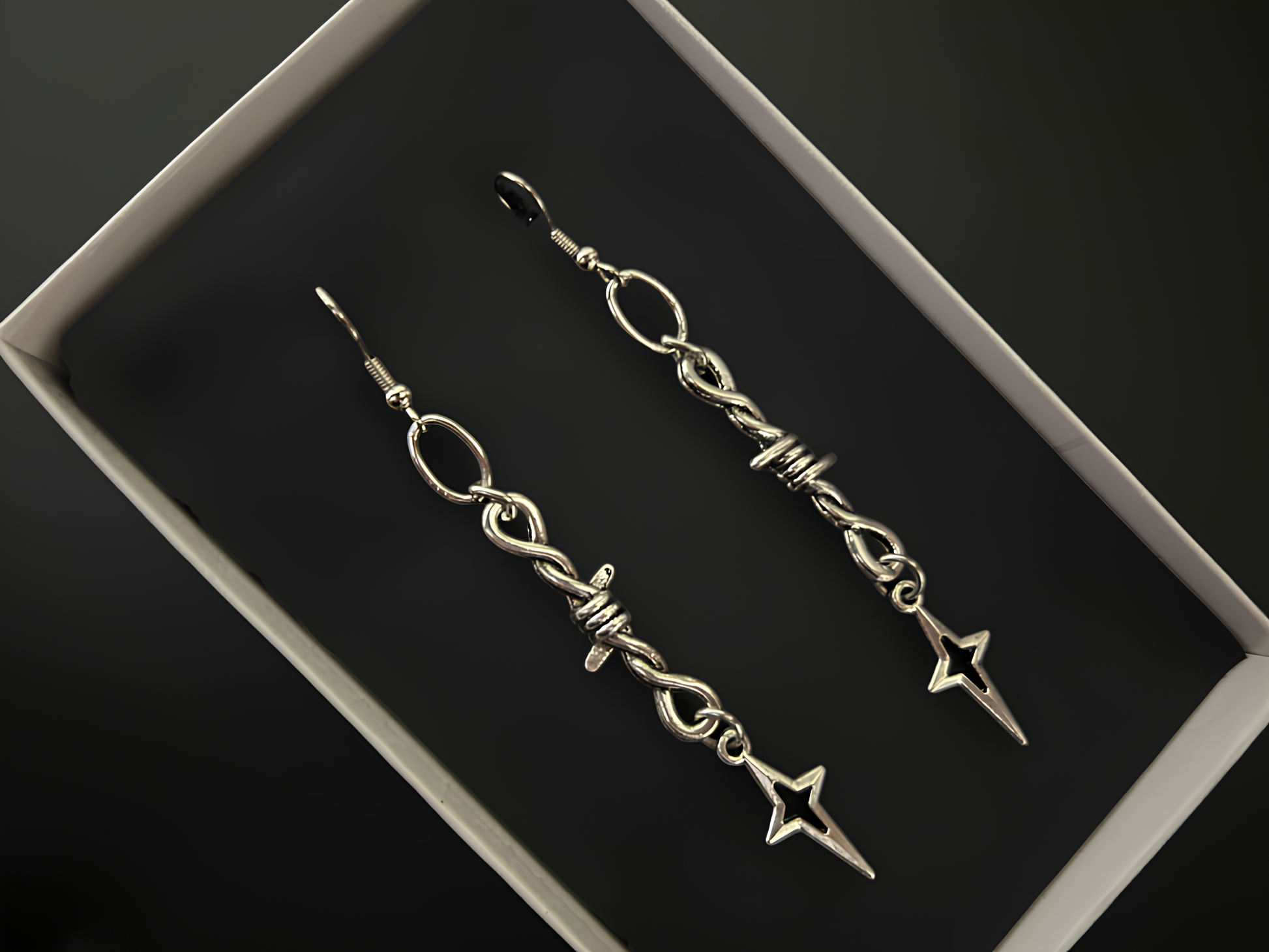 Tarnish resistant barbed wire knot star earrings by Phantom Cat - Anime cosplay, alt and punk jewelry and accessories for concerts and rock fashion shows. 