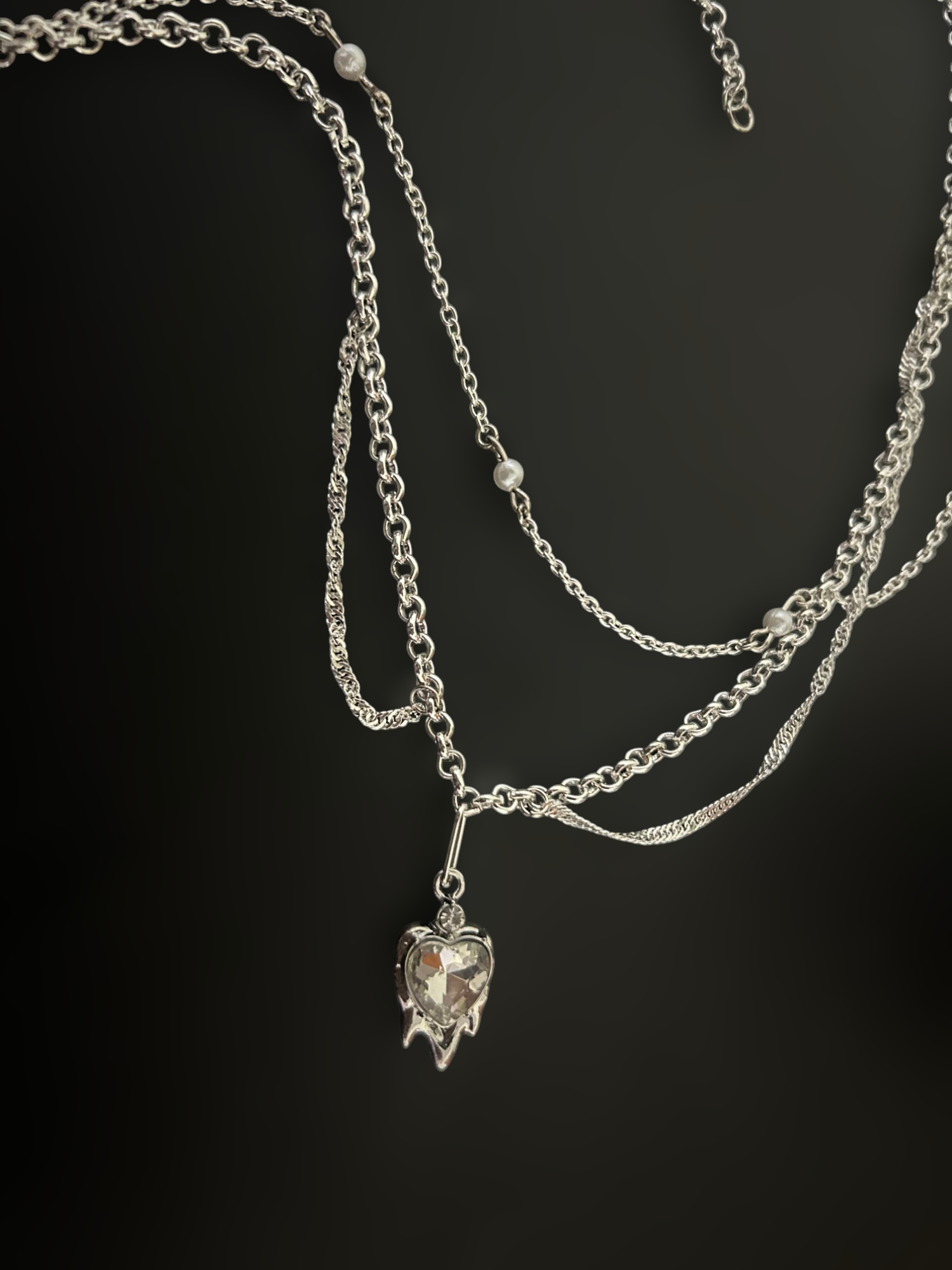 Witchlock Goth Punk Necklace by Phantom Cat. Layered Y2K silver chains with pearl beads and dripping heart crystal pendant. Grunge and concert jewelry for everyday wear. 